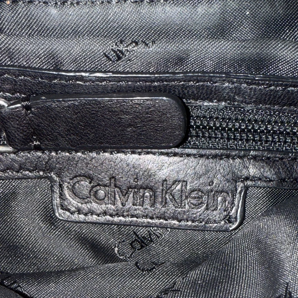 Calvin Klein Black Quilted Crossbody Bag with Silver Accents